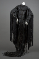 Wendy Red Star, síkahpoyíí / bishée / baleiíttaashtee (Motor Oil Buffalo Dress), 2013, vinyl leather, polyester thread, horn, glass and brass beads, and leather on faux sinew, Museum Purchase: Funds provided by Barbara Christy Wagner, © Wendy Red Star, 2014.19.1a-c